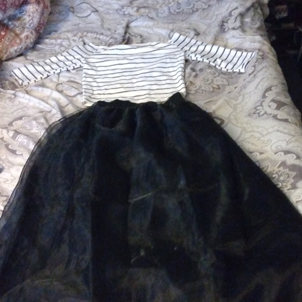 A black midi skirt and stripe crop mid sleeve top